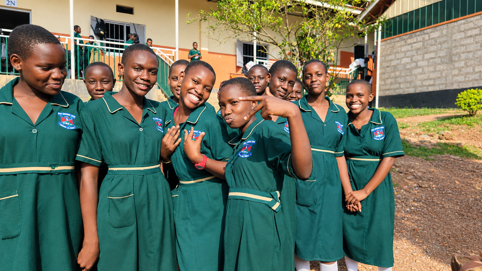 Joyful schoolgirls in green uniforms at Kira Secondary School